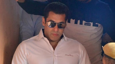 Indian Bollywood actor Salman Khan walks with officials as he leaves after a court appearance in Jodhpur on January 18, 2017. AFP