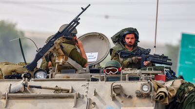 Israeli soldiers on patrol near the border with Gaza. Their generals might be preparing for a long war by besieging Hamas strongholds in an operation that could last a year, analysts have said. EPA