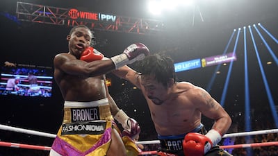 Manny Pacquiao and Adrien Broner in action. Reuters