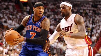 MIAMI, FL - MAY 09: Forward LeBron James #6 of the Miami Heat defends Forward Carmelo Anthony#7 of the New York Knicks in Game Five of the Eastern Conference Quarterfinals in the 2012 NBA Playoffs on May 9, 2012 at the American Airines Arena in Miami, Florida. NOTE TO USER: User expressly acknowledges and agrees that, by downloading and or using this photograph, User is consenting to the terms and conditions of the Getty Images License Agreement. Marc Serota/Getty Images/AFP== FOR NEWSPAPERS, INTERNET, TELCOS & TELEVISION USE ONLY ==