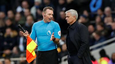 Tottenham Hotspur manager Jose Mourinho speaks with an assistant referee. Reuters