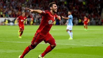 Hakan Calhanoglu of Bayer Leverkusen celebrates after scoring his team's first goal in their Champions League play-off win over Lazio on Wednesday night. Lars Baron / Bongarts / Getty Images / August 26, 2015
