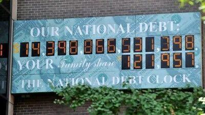 The National Debt Clock, a billboard-size digital display showing the increasing US debt. The clock ticked down to the August 2 deadline. AFP PHOTO/Stan HONDA