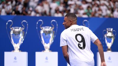 Real Madrid new boy Kylian Mbappe in the No 9 shirt he will wear for the Spanish club. Getty Images