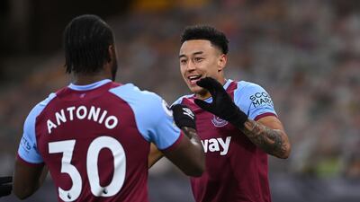 West Ham United's Jesse Lingard celebrates with Michail Antonio after scoring their side's first goal of the game during the Premier League match at the Molineux Stadium, Wolverhampton, England. PA