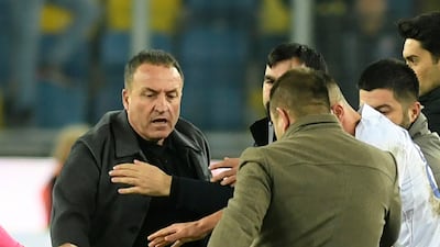 An unidentified man kicks referee Halil Umut Meler. AP