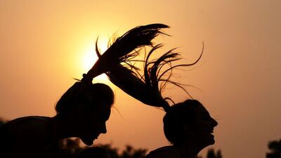 Sunrisers Hyderabad cheerleaders perform a routine as the sun sets during the 2016 Indian Premier League (IPL) Twenty20 cricket match between Kolkata Knight Riders and Sunrisers Hyderabad at The Eden Gardens Cricket Stadium in Kolkata on May 22, 2016. Dibyangshu Sarkar / AFP