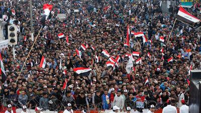 Followers of Shiite cleric Moqtada Al Sadr chant slogans demanding government reform during a demonstration at Tahrir square in Baghdad. AP