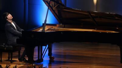 Readers applaud a well-behaved audience for pianist Lang Lang. Delores Johnson / The National