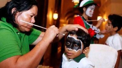 Majid Jamal, left, and Sultan Hamid, both 7, have their faces painted at a special iftar event organised by Watani in Dubai.