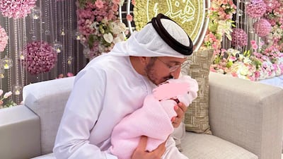 Sheikha Latifa posted a picture of her daughter being cradled by her husband, Sheikh Faisal bin Saud. Photo: Sheikha Latifa / Instagram