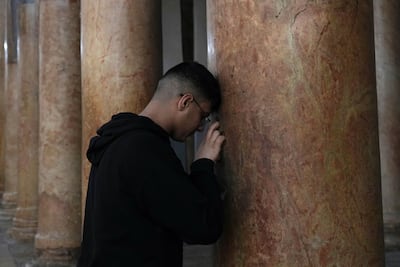 A worshipper visits the Church of the Nativity in the West Bank city of Bethlehem on December 17. For Palestinian Christians, the nativity story gives hope to those who have lost hope. AP