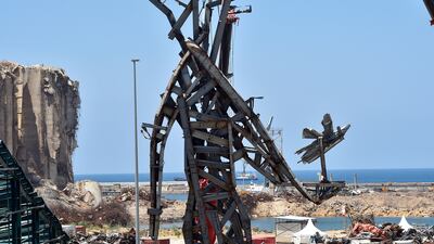 Workers install a monument inside Beirut port as a remembrance for the victims of the August 4 port blast in Beirut, Lebanon, July 27, 2021. EPA