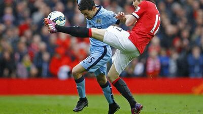 Manchester United's Daley Blind vies with Jesus Navas of Manchester City during their Premier League contest on Sunday. Darren Staples / Reuters / April 12, 2015