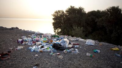 An illegal waste deposit lays on the shores near the mangrove islands. ((Silvia Razgova/The National)