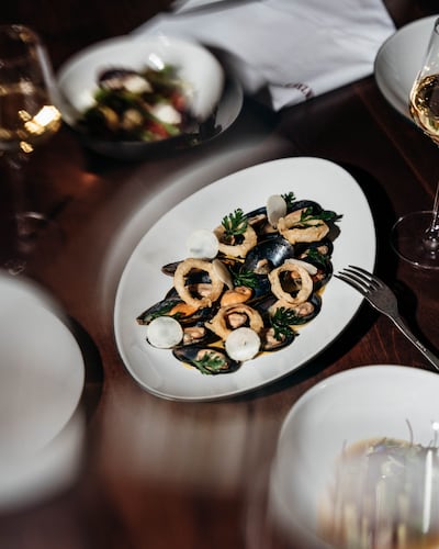 Chez Wam's mussels in a coconut curry cream with crispy onions. Photo: Rikas