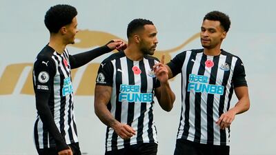 Newcastle United striker Callum Wilson, centre, celebrates after scoring the opening goal in his team's 2-1 victory over Everton on Sunday, November 1. AFP