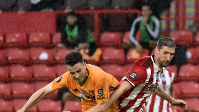 Wolverhampton Wanderers' Portuguese midfielder Diogo Jota, left, vies with Sheffield United's English defender Chris Basham. AFP