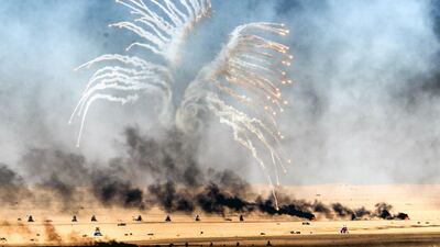 A Kuwaiti military helicopter takes part in a live ammunition military exercise at Udaira military range, 140 km North of Kuwait City. Yasser Al-Zayyat / AFP