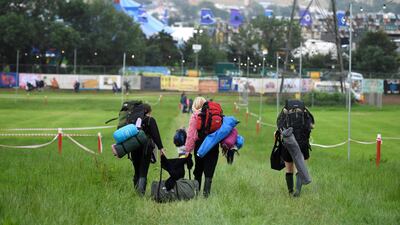 Festival goers arrive as the gates open during day one of Glastonbury Festival in 2019. Getty Images