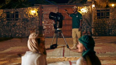 An astronomer talks guests through what's visible in the evening's sky during a night safari experience. Photo: Platinum Heritage