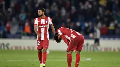 Atletico Madrid players Renan Lodi, left, and Joao Felix after the draw against Levante on Thursday. Reuters