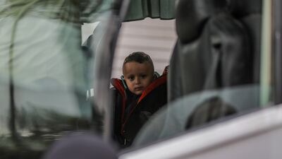 A child inside a vehicle in Khan Younis as wounded and sick Palestinians prepare to leave the Gaza Strip through the Rafah crossing for medical treatment abroad. EPA