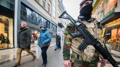 Soldiers and police patrol in Rue Neuve, the biggest shopping street in Brussels, where all shops were closed after a maximum-level terror alert was issued on November 21, 2015. Stephanie Lecocq / EPA