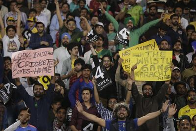 Spectators cheer during a game between Peshawar Zalmi and Karachi Kings, at Gaddafi Stadium in Lahore. Rahat Dar / EPA