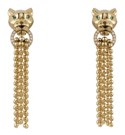 Panthère De Cartier collection pendant earrings, in 18K yellow gold, brilliant cut diamonds, onyx and tsavorite garnet. Courtesy Cartier