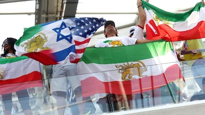 Iran fans display a combined pre-Iranian Revolution, Israel and United States flag inside the stadium before the match between Iran and New Zealand in Los Angeles. Reuters