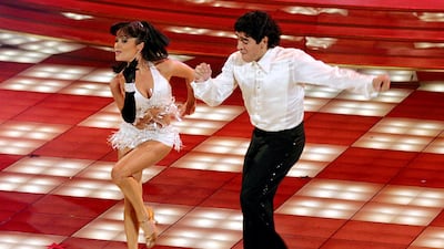 Maradona dances with Italian Angela Panico during the TV show "Ballando con le stelle" in Rome in October 2005. AFP