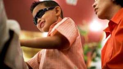 James Lumasag, seven, has trouble seeing because he suffers from Stevens-Johnson Syndrome.