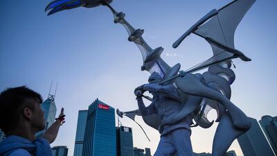 A man raises his hand towards a performer at the annual Clockenflap music festival in Hong Kong. AFP
