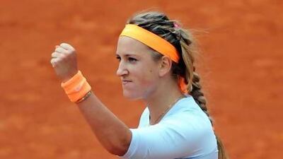 Victoria Azarenka, right, shakes hands with her vanquished rival Francesca Schiavone. Yoan Valat / EPA
