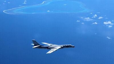 A Chinese bomber patrols the islands and reefs in the South China Sea. Liu Rui / Xinhua via AP