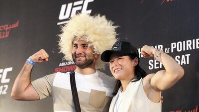 A fan with fighter Zhang Wei Li at the UFC fan zone. Yas Island, Abu Dhabi. Chris Whiteoak / The National