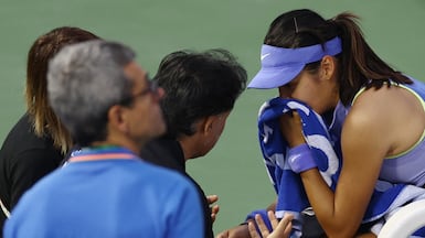 Britain's Emma Raducanu receives medical attention during her match against Croatia's Antonia Ruzic at the Dubai Duty Free Tennis Championships. Reuters