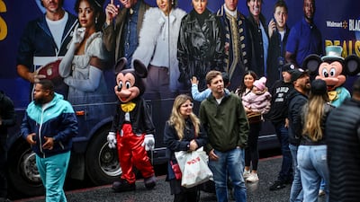 Street performers and tourists walk along Hollywood Boulevard in Los Angeles, California. Reuters
