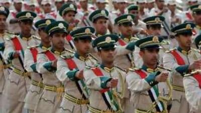 Cadets from the Dubai Police Academy march on Jumeirah Beach Road in Dubai yesterday.