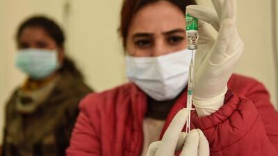 A medical worker prepares to inoculate a woman with a Covid-19 vaccine at the Civil Hospital in Amritsar, in northwest India, on January 27. AFP