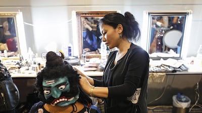 Make up artists Maya Lama puts the finishing touches to Kiran Jivnani back stage before the start of the talent leg.