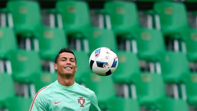 Portugal forward Cristiano Ronaldo shown at Monday's training session ahead of Tuesday's Euro 2016 match against Iceland in Saint-Etienne. Francisco Leong / AFP / June 13, 2016