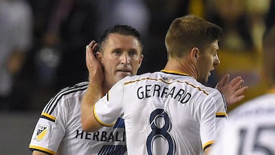 Robbie Keane, left, is congratulated by Steven Gerrard after scoring during the first half against Club America. Mark J. Terrill / AP Photo