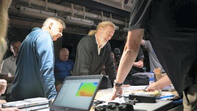 Team reviewing dive sites in the Atlantic Ocean. Courtesy: The Five Deeps Expedition
