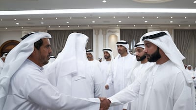 Dr Sheikh Hazza and Dr Sheikh Khaled bin Sultan receive mourners at Al Mushrif Palace. Mohamed Al Hammadi / Ministry of Presidential Affairs