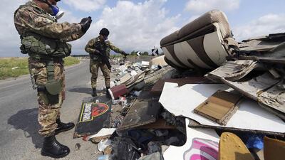 Waste management in Italy is so lucrative that even the organised crime group Camorra has taken over trash disposal contracts since the 1990s, dumping trash from all over the country and other parts of Europe in unauthorised fields or landfills. Above, an Italian soldier takes photos of garbage on a road in southern Italy. Alessandro Bianchi / Reuters