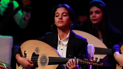 Iraqi musicians play the oud during a concert in Baghdad