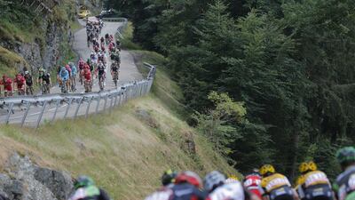 The peloton speed downhill during the Stage 18 of the Tour de France through the French Alps to Saint-Jean-de-Maurienne on Thursday. Christophe Ena / AP