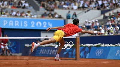 Spain's Carlos Alcaraz returns to Canada's Felix Auger-Aliassime. AFP
